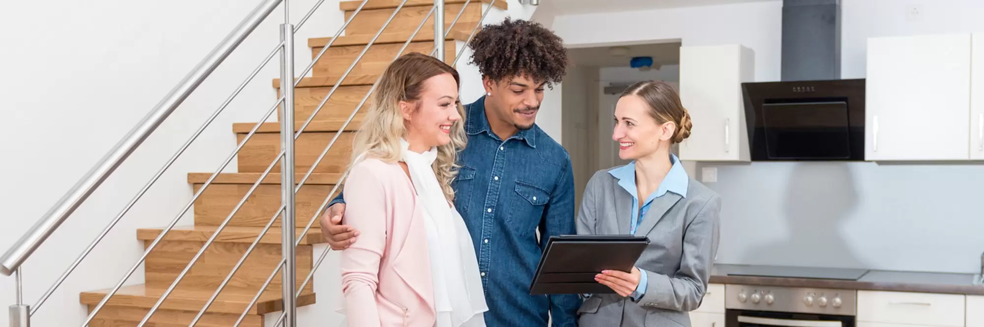 Young couple getting tour through apartment they consider renting.