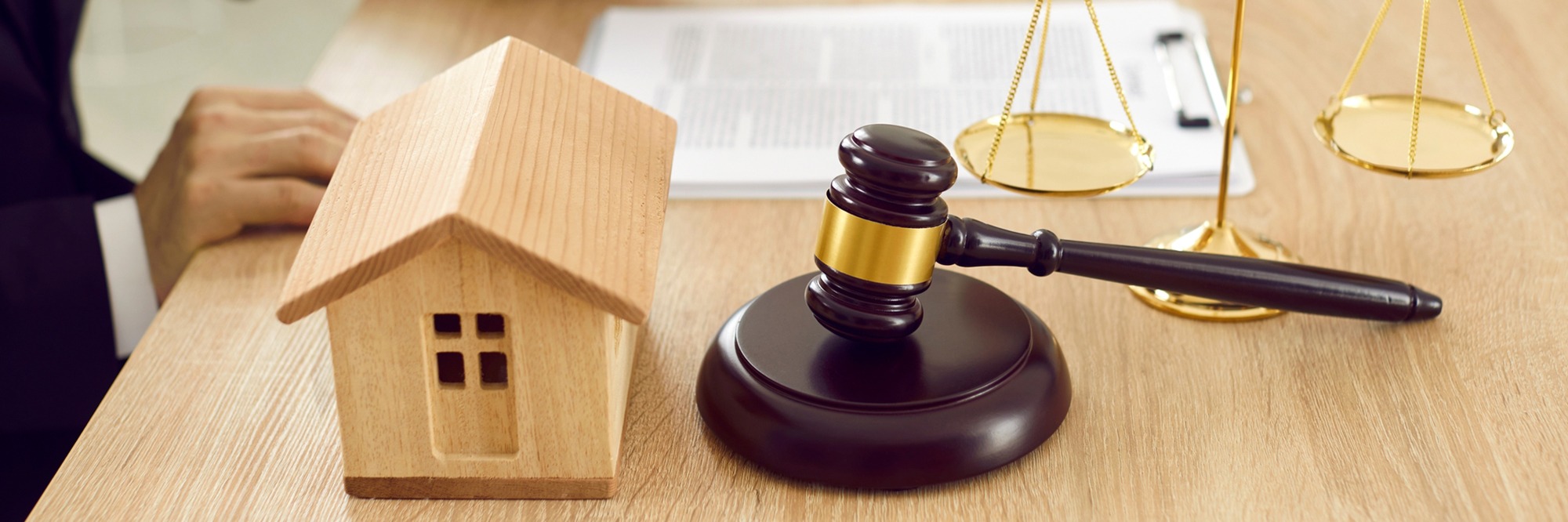 Happy millennial family couple and realtor broker shake hands buying new home or taking mortgage loan investment in bank office, clients handshake real estate agent making property purchase deal.