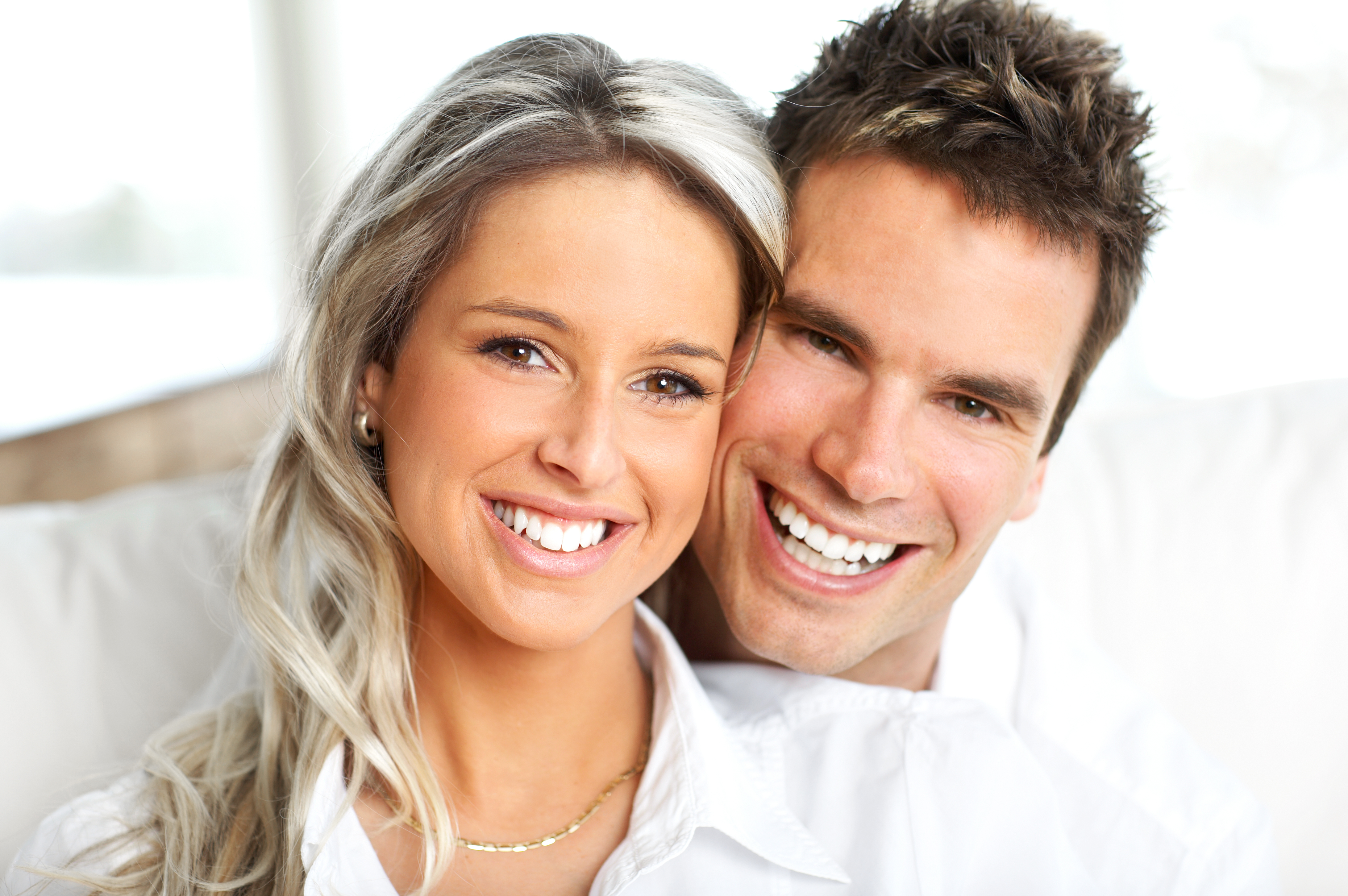 Young love couple smiling in the comfortable apartment